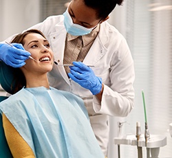 Female patient undergoing checkup in the dentist’s chair